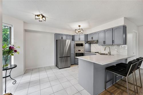 240 Quigley Road|Unit #204, Hamilton, ON - Indoor Photo Showing Kitchen With Upgraded Kitchen