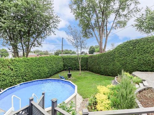 ExtÃ©rieur - 162 Rue Des Hêtres, Saint-Eustache, QC - Outdoor With Above Ground Pool With Backyard