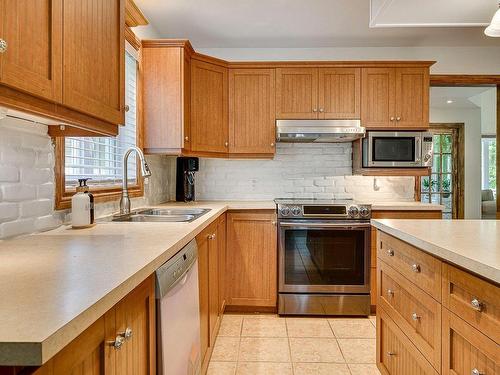 Cuisine - 712 Rue Alain, Saint-Colomban, QC - Indoor Photo Showing Kitchen With Double Sink