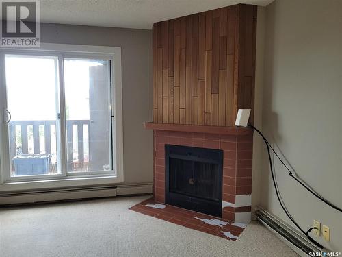 130 425 115Th Street E, Saskatoon, SK - Indoor Photo Showing Other Room With Fireplace