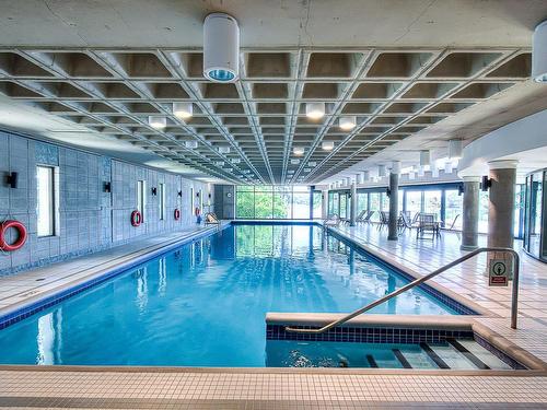 Piscine - 203-4450 Prom. Paton, Laval (Chomedey), QC - Indoor Photo Showing Other Room With In Ground Pool