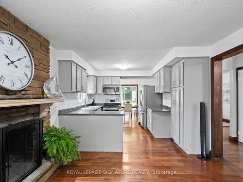 1213 Gloucester Sq, Pickering, ON - Indoor Photo Showing Kitchen With Fireplace