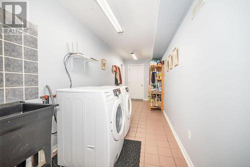 Main floor laundry/mudroom with access to attached garage and side yard - 224 Thomas Street, Deep River, ON - Indoor Photo Showing Laundry Room