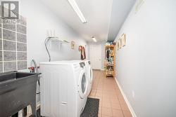 Main floor laundry/mudroom with access to attached garage and side yard - 