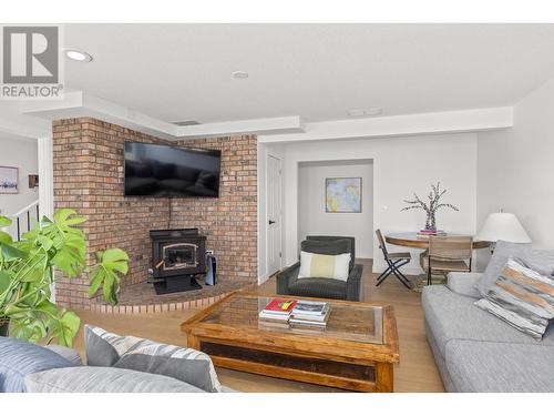 403 Stellar Drive, Kelowna, BC - Indoor Photo Showing Living Room With Fireplace