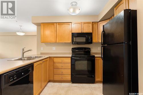 210 215 Smith Street N, Regina, SK - Indoor Photo Showing Kitchen With Double Sink