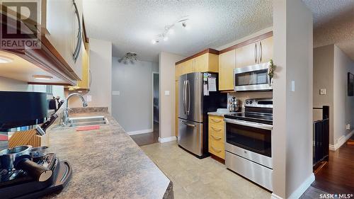 2834 Kutarna Crescent, Regina, SK - Indoor Photo Showing Kitchen With Stainless Steel Kitchen With Double Sink