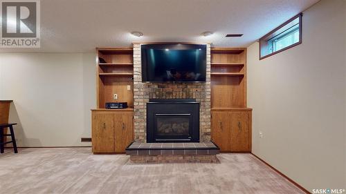 2834 Kutarna Crescent, Regina, SK - Indoor Photo Showing Living Room With Fireplace