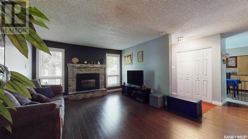2834 Kutarna Crescent, Regina, SK - Indoor Photo Showing Living Room With Fireplace