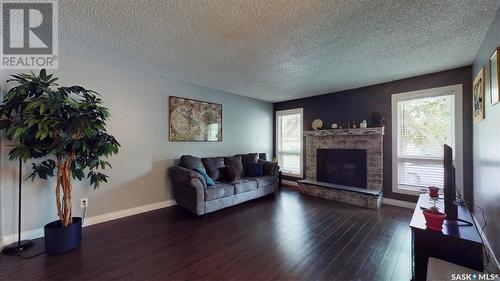 2834 Kutarna Crescent, Regina, SK - Indoor Photo Showing Living Room With Fireplace