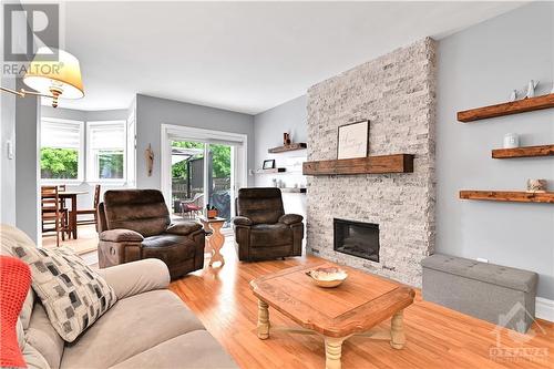 19 Townsend Drive, Ottawa, ON - Indoor Photo Showing Living Room With Fireplace