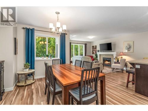 3473 Creekview Crescent, West Kelowna, BC - Indoor Photo Showing Dining Room With Fireplace