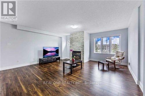 64 - 1292 Sherwood Mills Boulevard, Mississauga, ON - Indoor Photo Showing Living Room With Fireplace