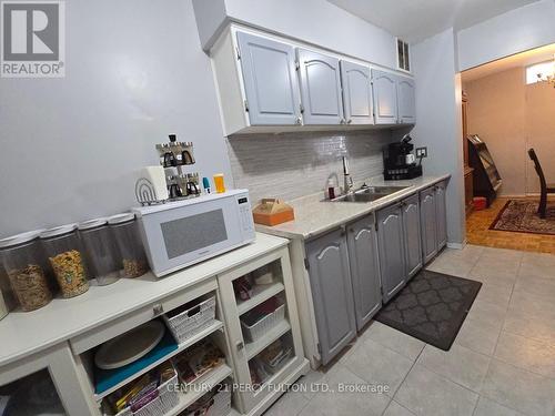 804 - 3420 Eglinton Avenue E, Toronto, ON - Indoor Photo Showing Kitchen With Double Sink