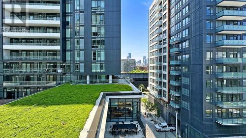 E603 - 34 Tubman Avenue, Toronto, ON - Outdoor With Balcony With Facade