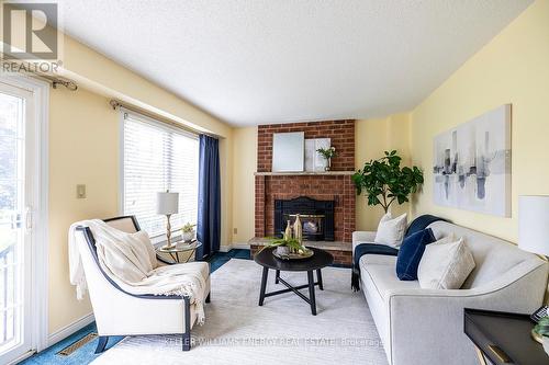 2 Hampstead Gate, Clarington, ON - Indoor Photo Showing Living Room With Fireplace