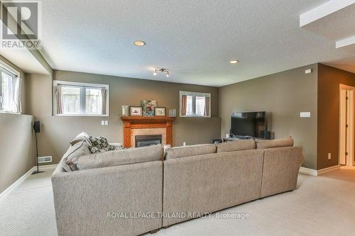 909 Fogerty Street, London, ON - Indoor Photo Showing Living Room With Fireplace