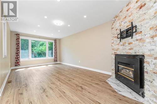 156 Knudson Drive, Ottawa, ON - Indoor Photo Showing Living Room With Fireplace