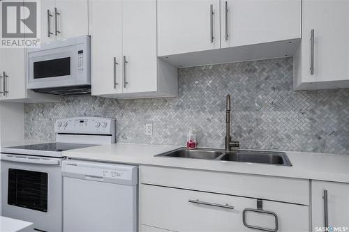 304 307 Tait Crescent, Saskatoon, SK - Indoor Photo Showing Kitchen With Double Sink