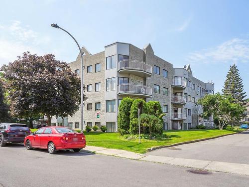 Frontage - 402-5250 Rue Riviera, Montréal (Pierrefonds-Roxboro), QC - Outdoor With Balcony With Facade