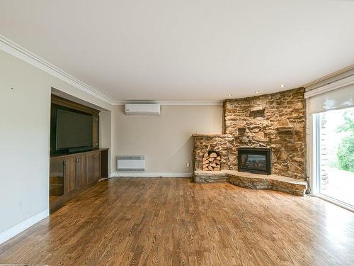 Salon - 3325 Rue Des Luminaires, Sainte-Adèle, QC - Indoor Photo Showing Living Room With Fireplace