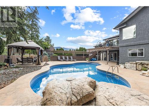 145 Magic Drive, Kelowna, BC - Outdoor With In Ground Pool With Backyard