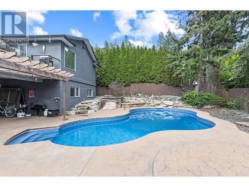 145 Magic Drive, Kelowna, BC - Outdoor With In Ground Pool With Backyard