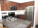 801 - 3 Michael Power Place, Toronto, ON  - Indoor Photo Showing Kitchen With Double Sink 