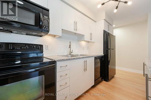 1745 - 35 Viking Lane, Toronto (Islington-City Centre West), ON - Indoor Photo Showing Kitchen With Double Sink With Upgraded Kitchen