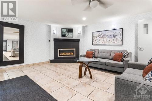 198 Scott Street Unit#404, St Catharines, ON - Indoor Photo Showing Living Room With Fireplace