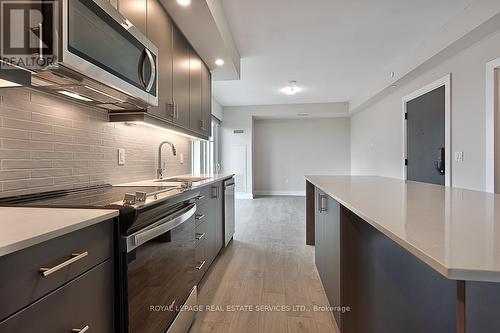 1208 - 3200 William Coltson Avenue, Oakville, ON - Indoor Photo Showing Kitchen With Upgraded Kitchen