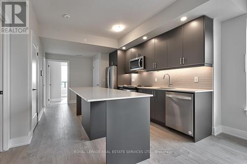 1208 - 3200 William Coltson Avenue, Oakville, ON - Indoor Photo Showing Kitchen With Upgraded Kitchen