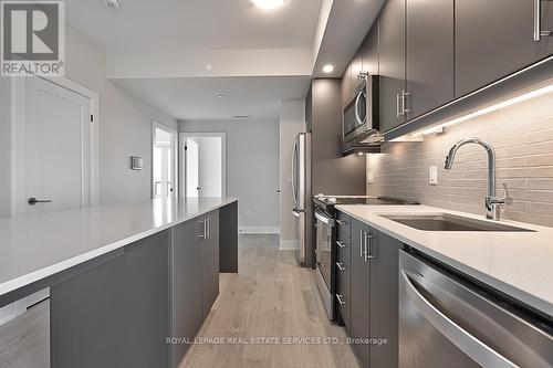 1208 - 3200 William Coltson Avenue, Oakville, ON - Indoor Photo Showing Kitchen With Upgraded Kitchen