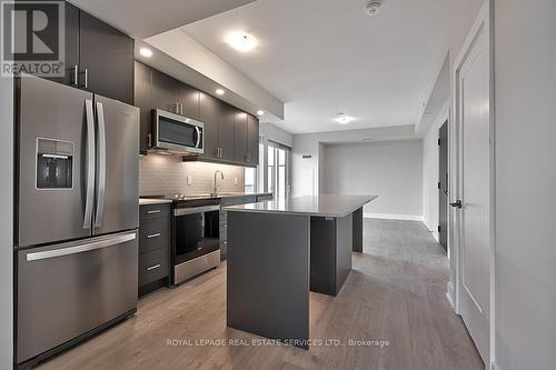 1208 - 3200 William Coltson Avenue, Oakville, ON - Indoor Photo Showing Kitchen With Upgraded Kitchen