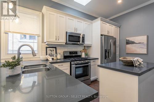 photos are prior to staging being removed - 581 Central Avenue, London, ON - Indoor Photo Showing Kitchen With Stainless Steel Kitchen With Double Sink With Upgraded Kitchen