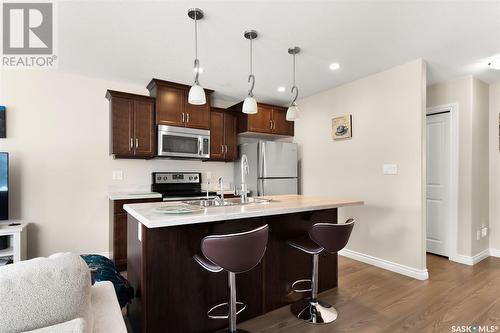 131 Plains Circle, Pilot Butte, SK - Indoor Photo Showing Kitchen With Double Sink