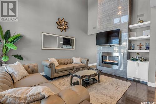 210 Mahabir Court, Saskatoon, SK - Indoor Photo Showing Living Room With Fireplace