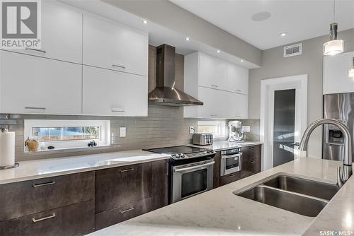 210 Mahabir Court, Saskatoon, SK - Indoor Photo Showing Kitchen With Double Sink With Upgraded Kitchen