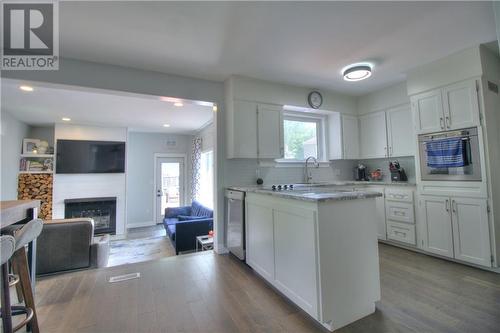 91 Birchwood, Moncton, NB - Indoor Photo Showing Kitchen With Fireplace