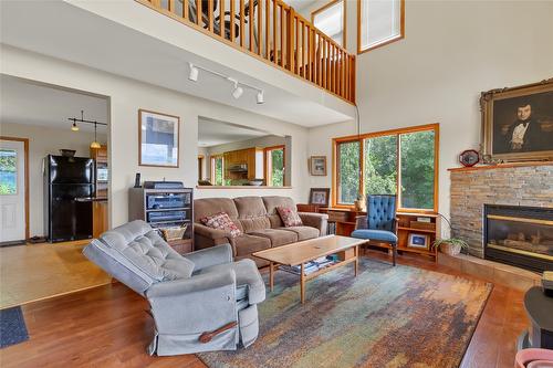 5600 Hartnell Road, Vernon, BC - Indoor Photo Showing Living Room With Fireplace