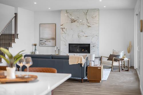 981 Lochness Street, Kelowna, BC - Indoor Photo Showing Living Room With Fireplace