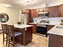 207-3350 Woodsdale Road, Lake Country, BC  - Indoor Photo Showing Kitchen With Stainless Steel Kitchen With Double Sink With Upgraded Kitchen 