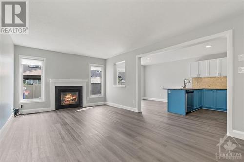 2651 Baynes Sound Way, Ottawa, ON - Indoor Photo Showing Living Room With Fireplace