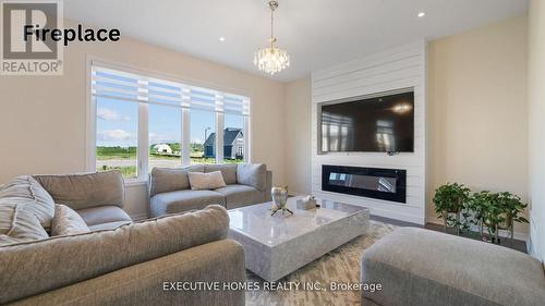 14 Lillian Way, Haldimand, ON - Indoor Photo Showing Living Room With Fireplace