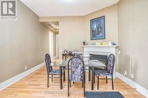 Tph6 - 25 Kingsbridge Garden Circle, Mississauga (Hurontario), ON - Indoor Photo Showing Dining Room With Fireplace