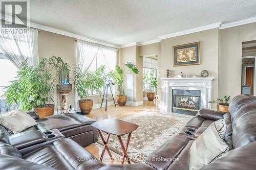 Tph6 - 25 Kingsbridge Garden Circle, Mississauga (Hurontario), ON - Indoor Photo Showing Living Room With Fireplace