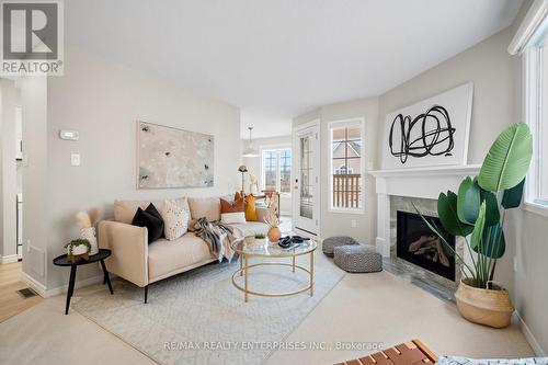 207 - 2055 Walkers Line, Burlington, ON - Indoor Photo Showing Living Room With Fireplace