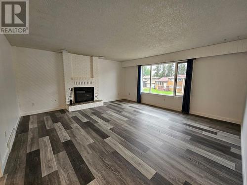 219 Cottonwood Crescent, Tumbler Ridge, BC - Indoor Photo Showing Living Room With Fireplace