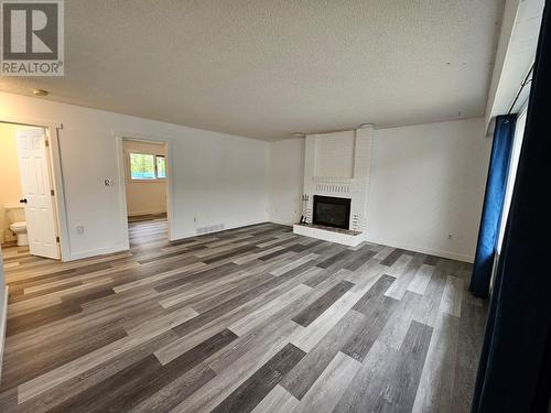 219 Cottonwood Crescent, Tumbler Ridge, BC - Indoor Photo Showing Living Room With Fireplace