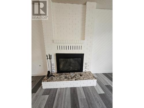 219 Cottonwood Crescent, Tumbler Ridge, BC - Indoor Photo Showing Living Room With Fireplace